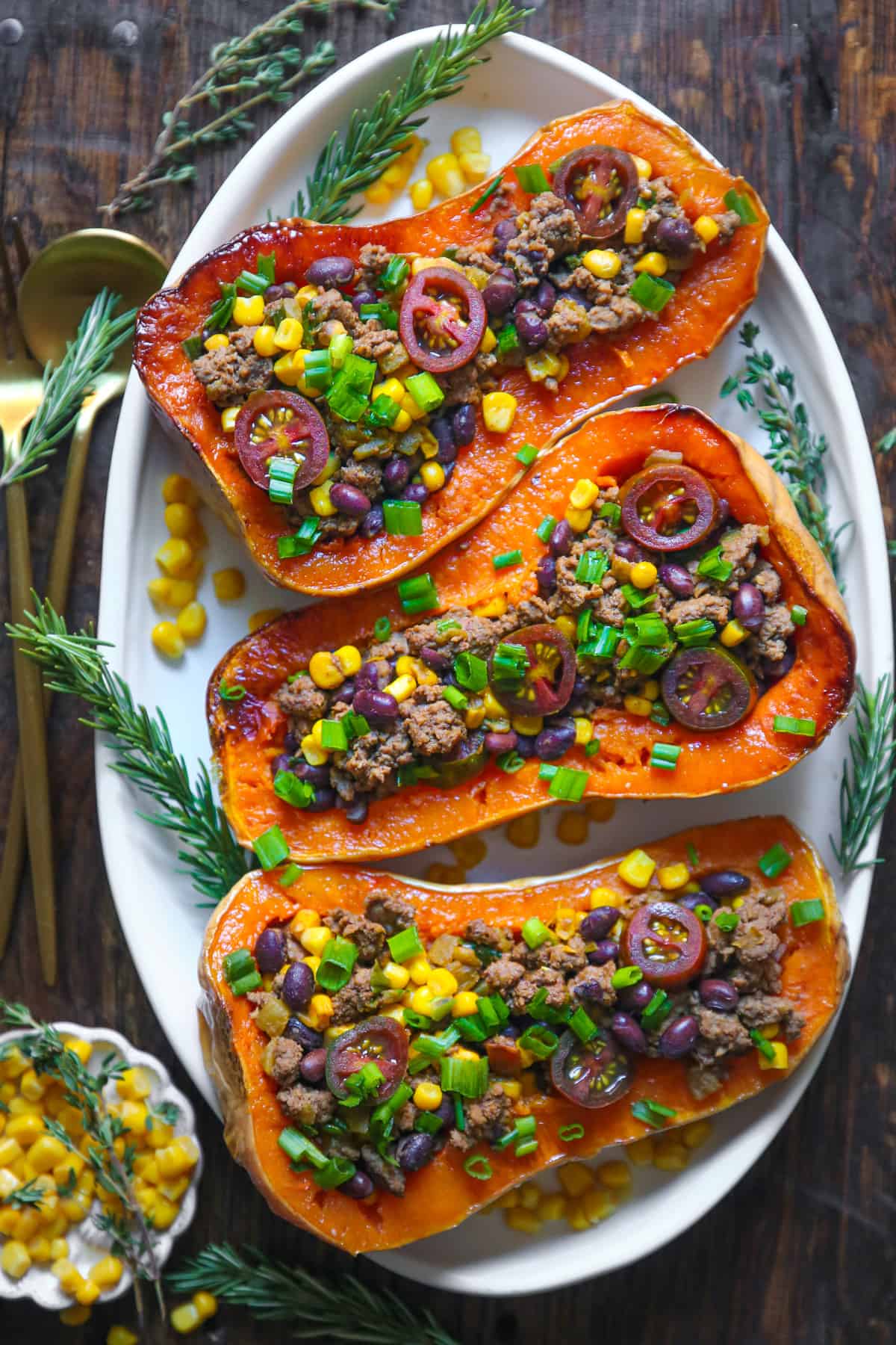 Southwestern Ground Beef Stuffed Butternut Squash with Black Beans, Corn, Tomatoes, Green Onions, mild Green Chiles.