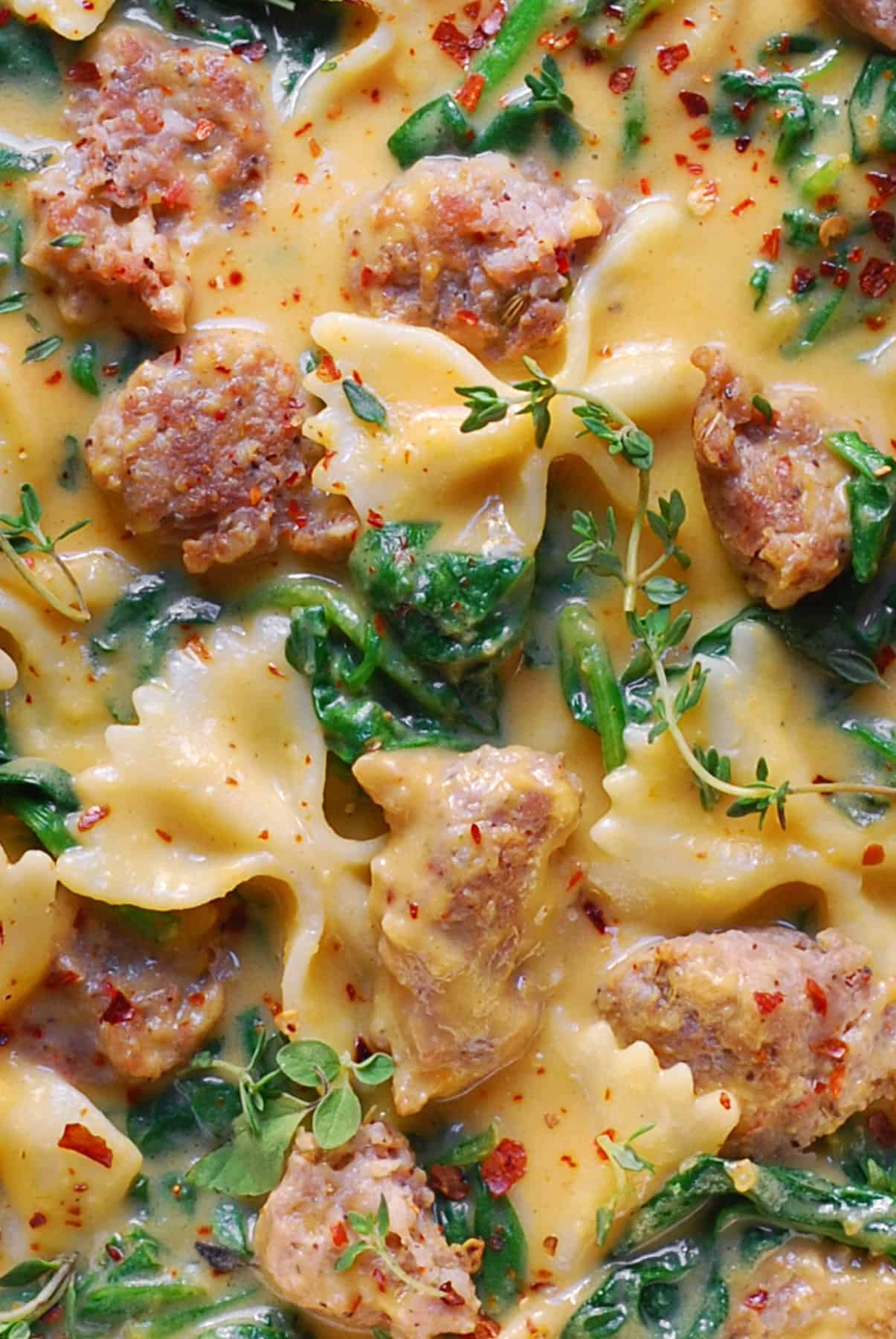 Creamy Butternut Squash Italian Sausage Bow-Tie Pasta with Spinach (close-up photo).