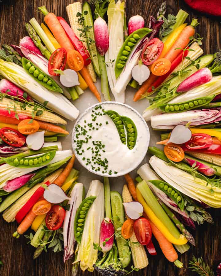 Thanksgiving veggie tray (in the shape of wreath) with Sour Cream and Chive Dip in the middle of the wreath.