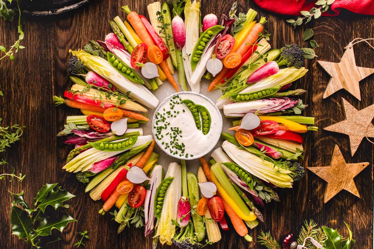 Thanksgiving veggie tray (in the shape of wreath) with Sour Cream and Chive Dip in the middle of the wreath.