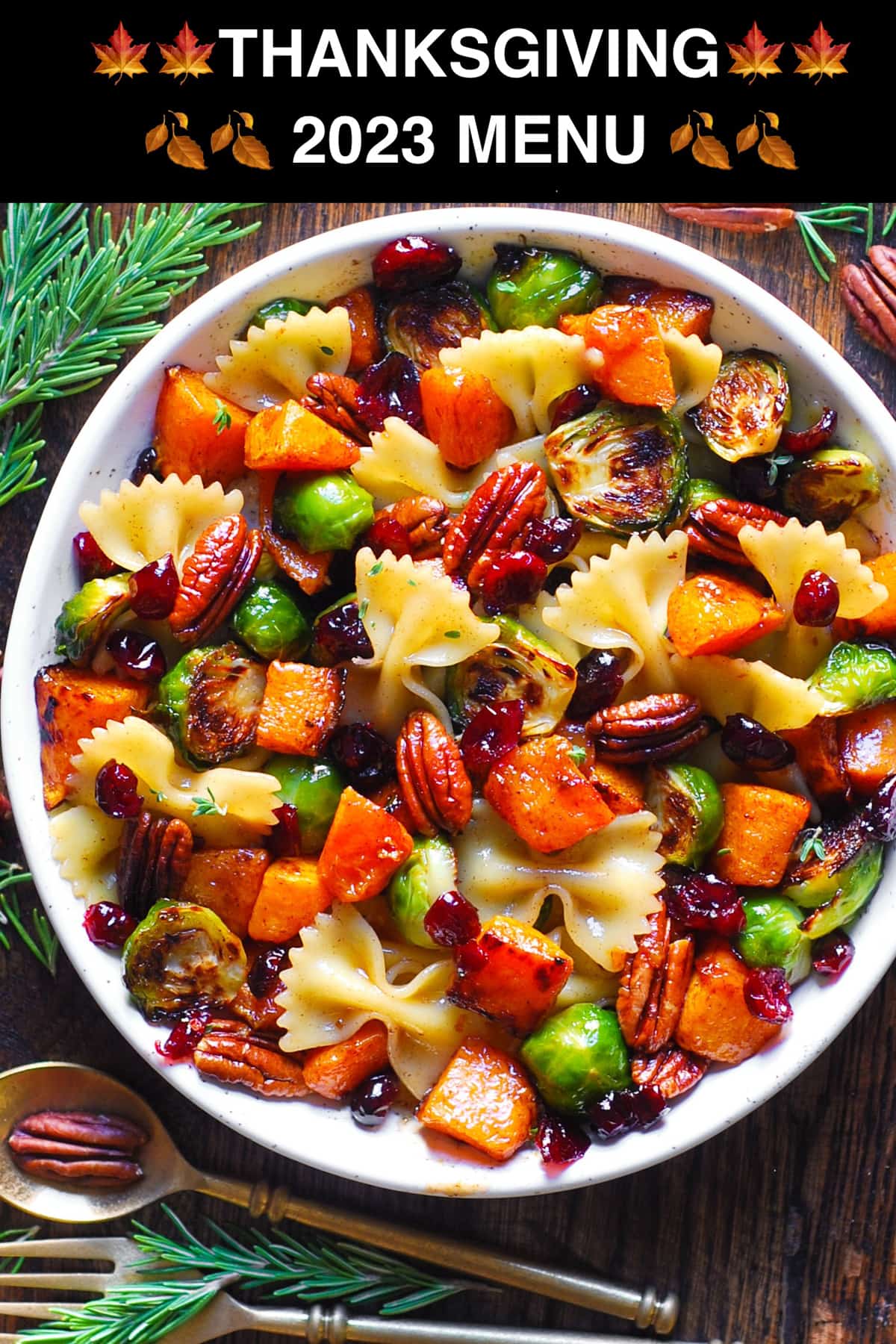Fall Pasta Salad with Roasted Butternut Squash, Brussels Sprouts, Pecans, and Cranberries - in a white bowl.