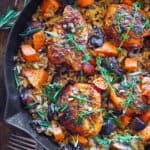 Chicken and Wild Rice with Roasted Sweet Potatoes and Mushrooms in a cast iron skillet.