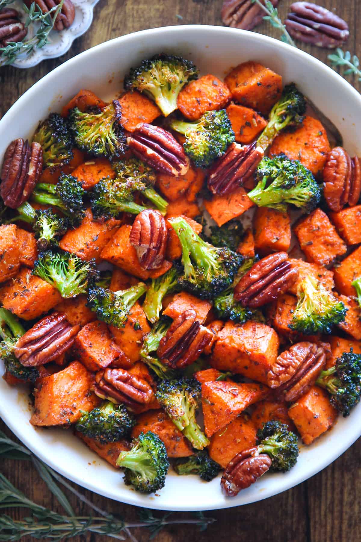 Sweet Potatoes, Broccoli, Pecans in a white bowl.