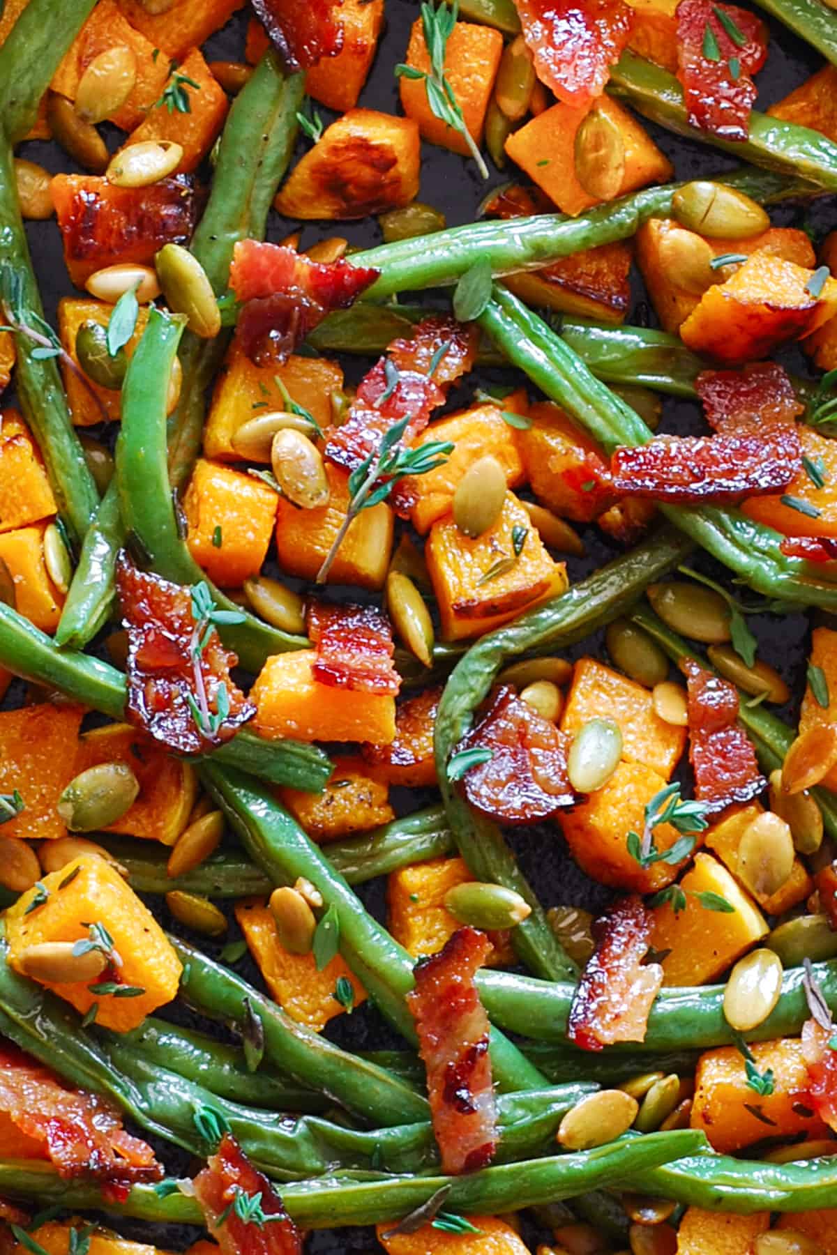Thanksgiving Roasted Vegetables (Butternut Squash and Green Beans) with Bacon and Pumpkin Seeds.