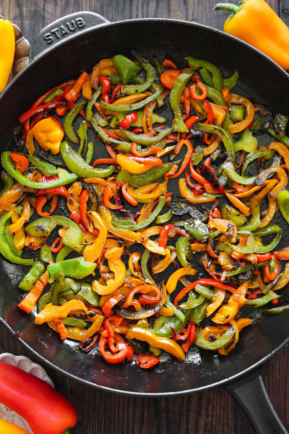 cooked bell peppers in a cast iron skillet