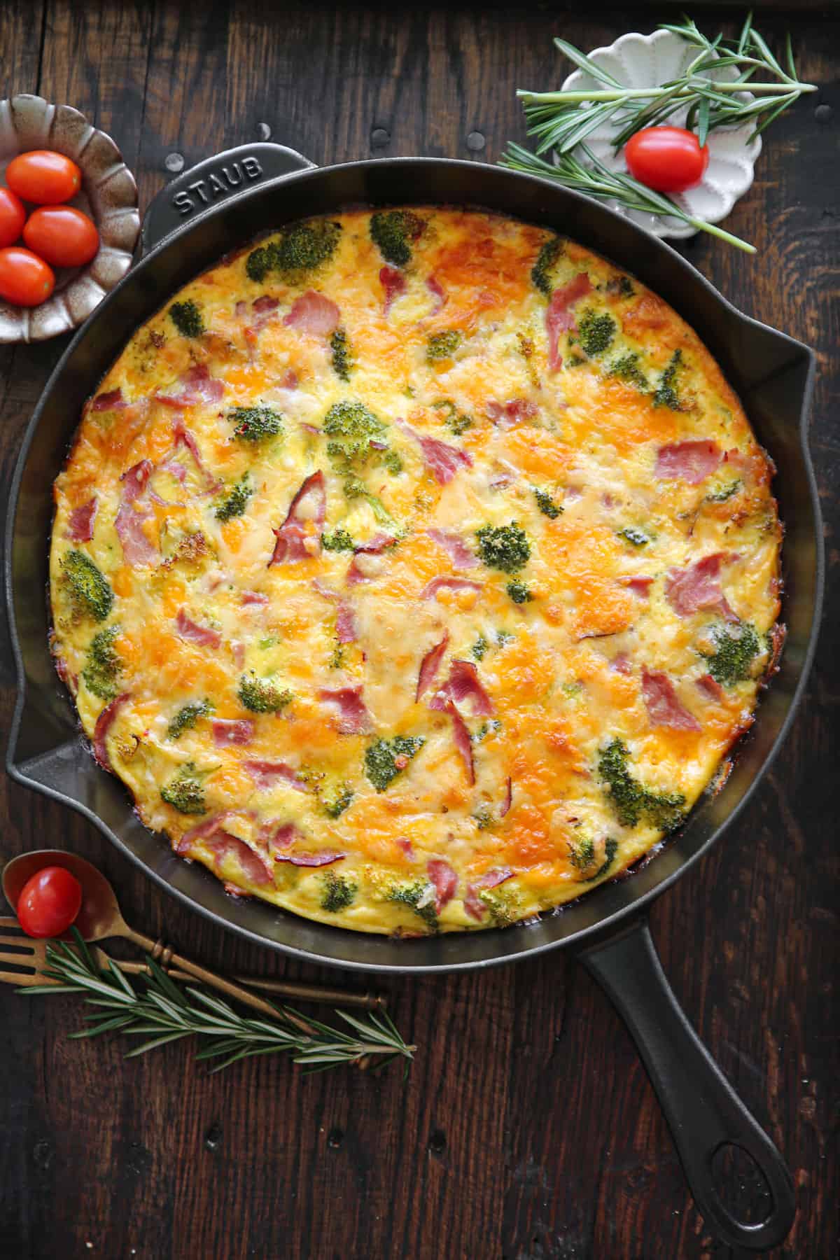 frittata with ham, broccoli, cheddar, and pepper jack cheese - in a cast iron skillet.