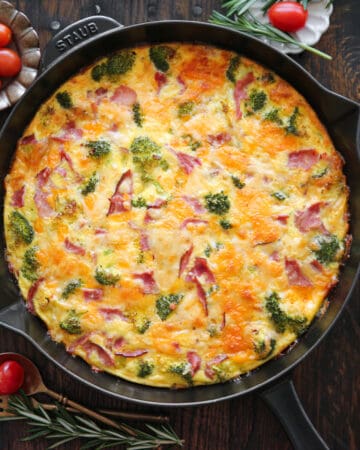 Frittata with Broccoli, Ham, Cheddar, and Pepper Jack Cheese - in a cast iron skillet.