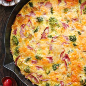 Frittata with Broccoli, Ham, Cheddar, and Pepper Jack Cheese - in a cast iron skillet.