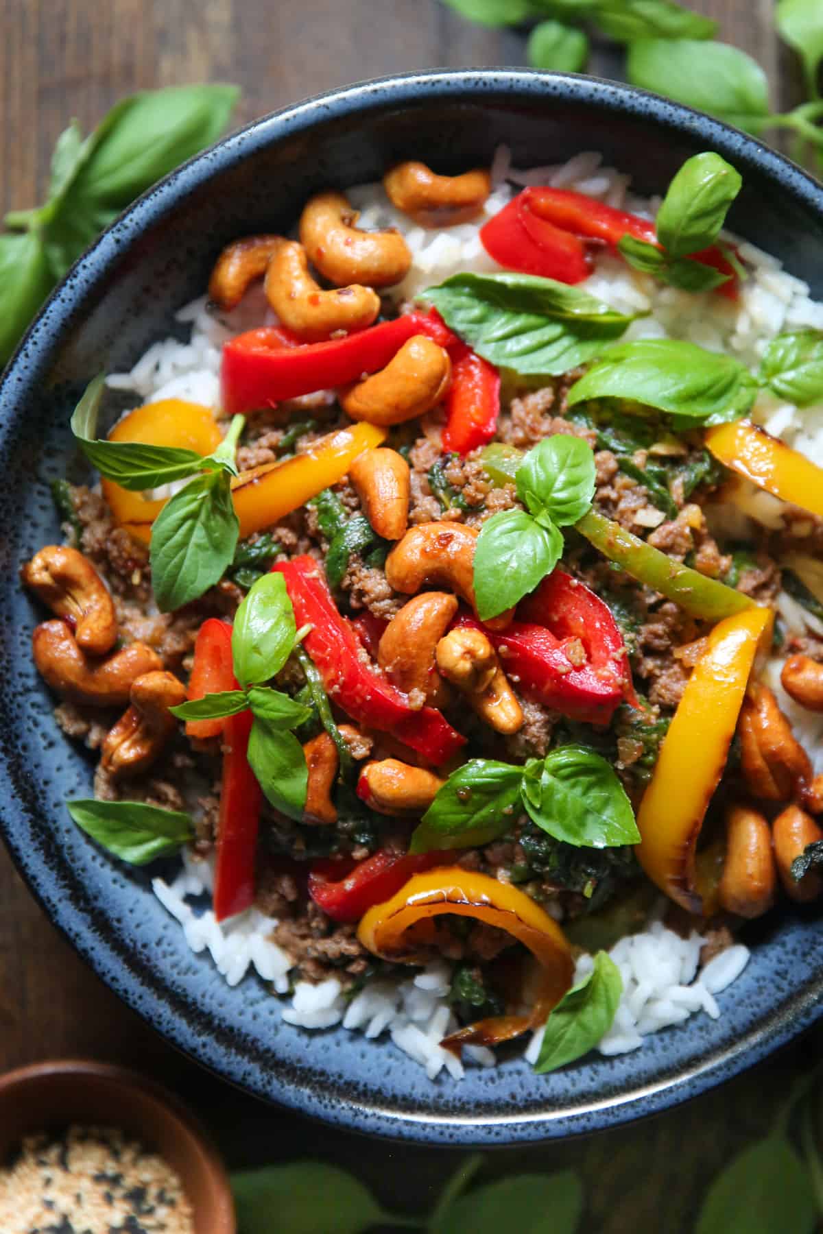 Thai Basil Beef with Bell Peppers and Cashews in a blue bowl.