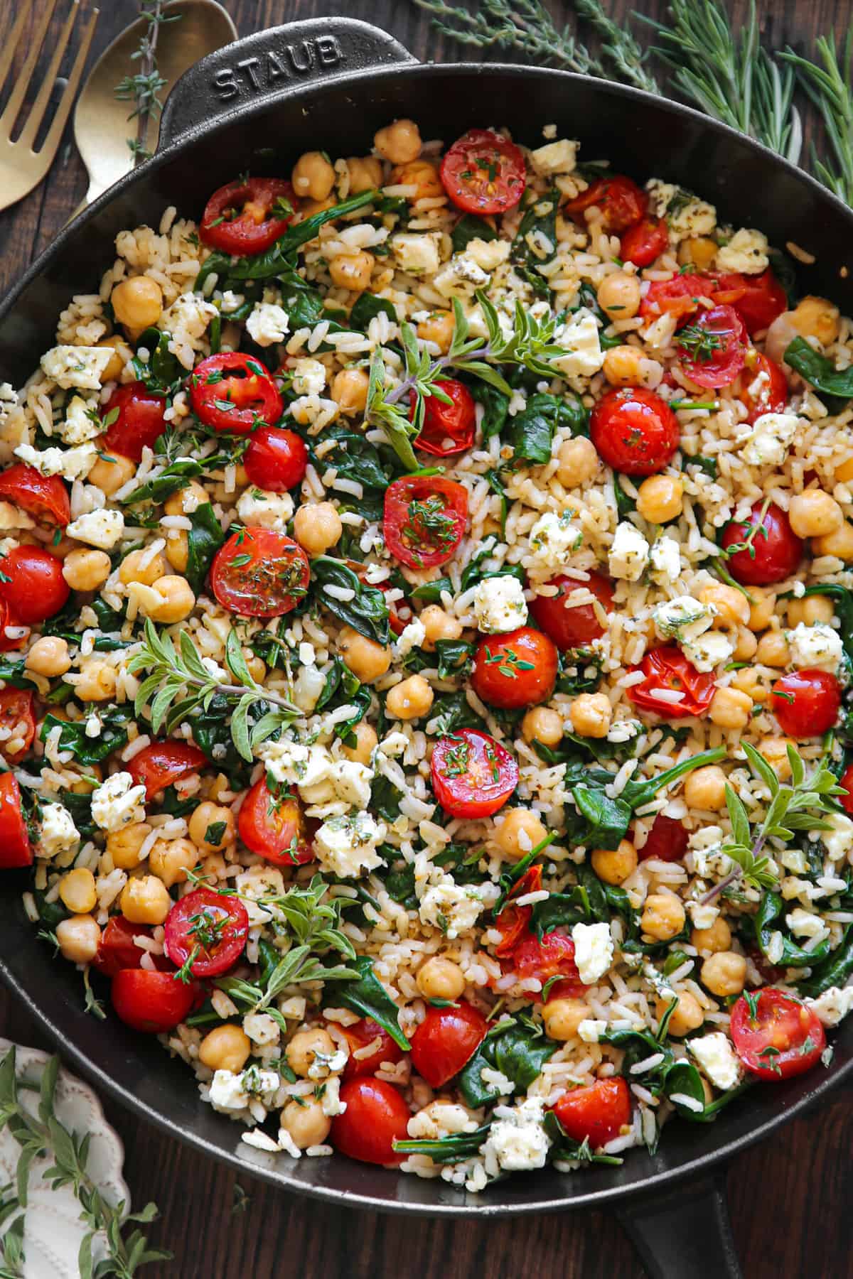 Mediterranean Lemon Rice with Chickpeas, Tomatoes, and Feta - in a cast iron skillet.