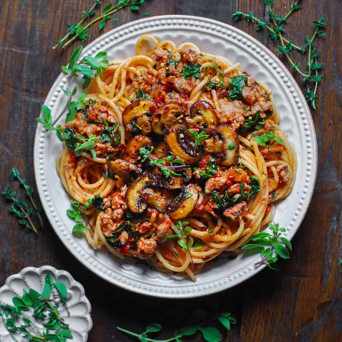 Sausage Mushroom Pasta with Spinach and Tomato Sauce - on a plate.