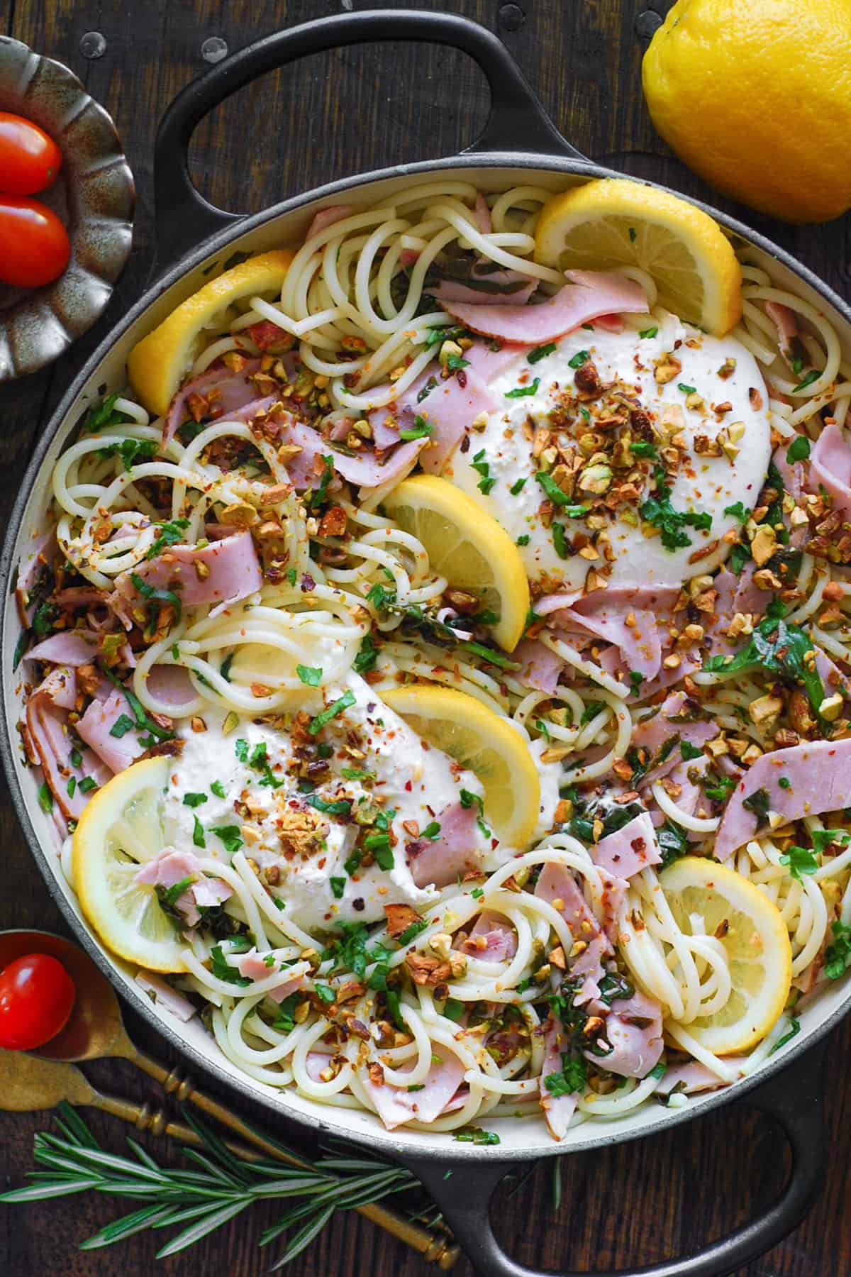 Ham Pasta with Spinach, Burrata Cheese, and Lemon Butter Sauce - in a cooking pan.