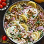 Ham Spaghetti Pasta with Spinach, Burrata Cheese, and Lemon Butter Sauce - in a cooking pan.