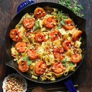 Shrimp pesto pasta with pine nuts - in a cast iron pan.
