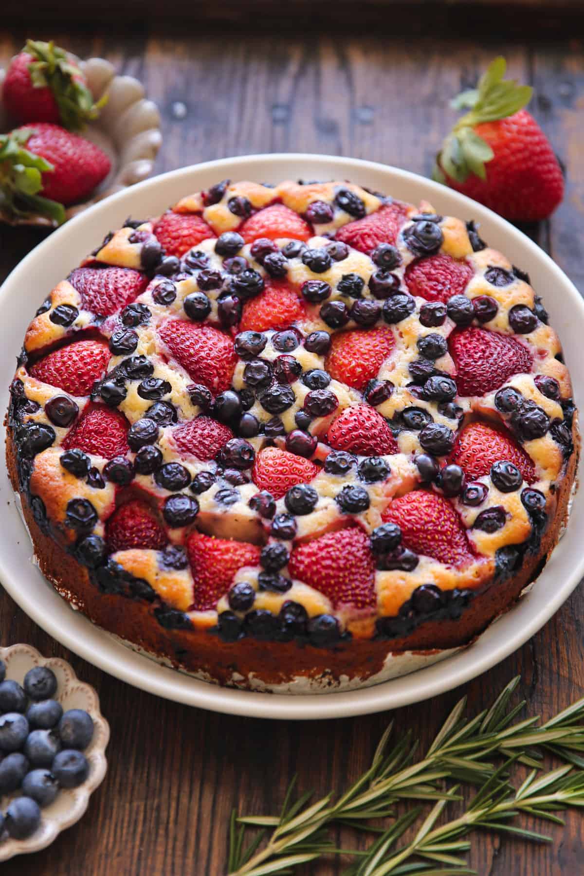 Strawberry Blueberry Cake - on a white platter.