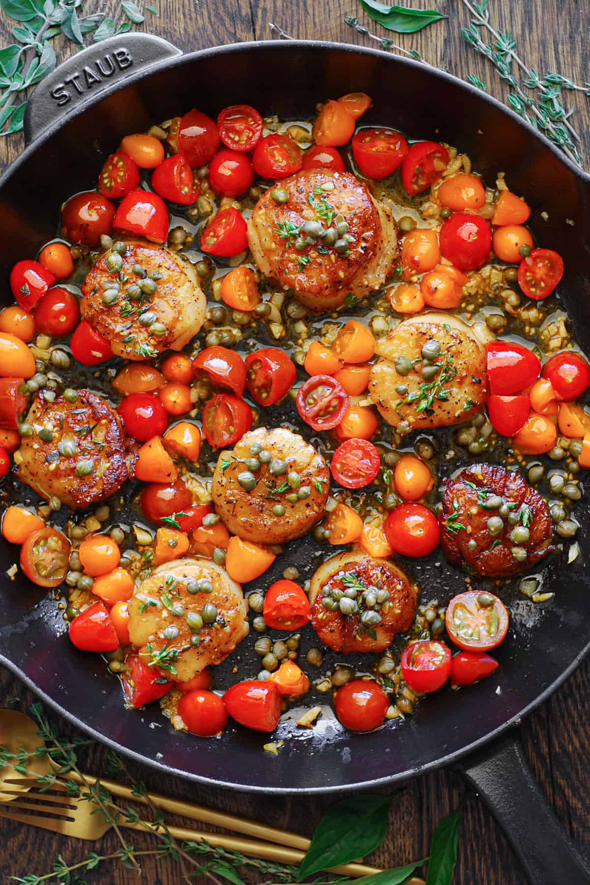 Mediterranean Scallops with Tomatoes and Capers - in a cast iron skillet.