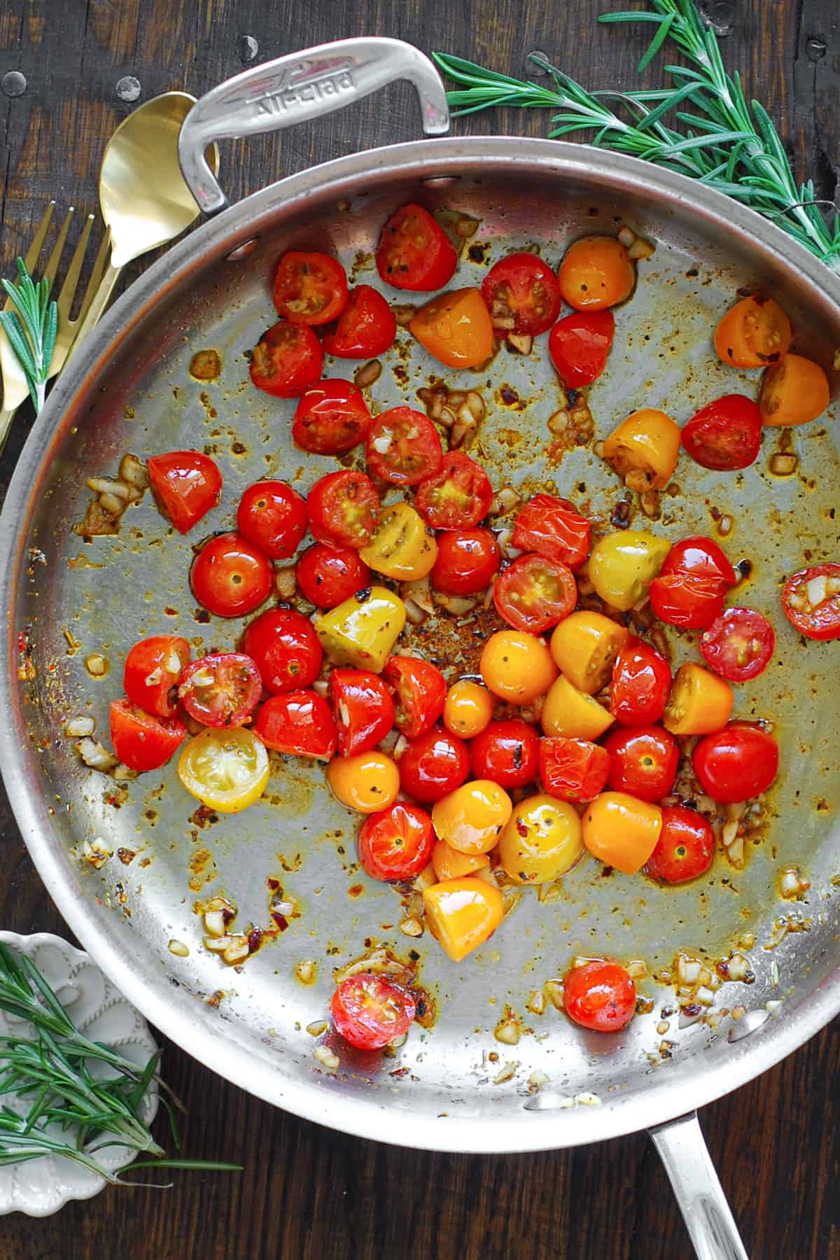 cooked cherry tomatoes - in a stainless steel skillet.