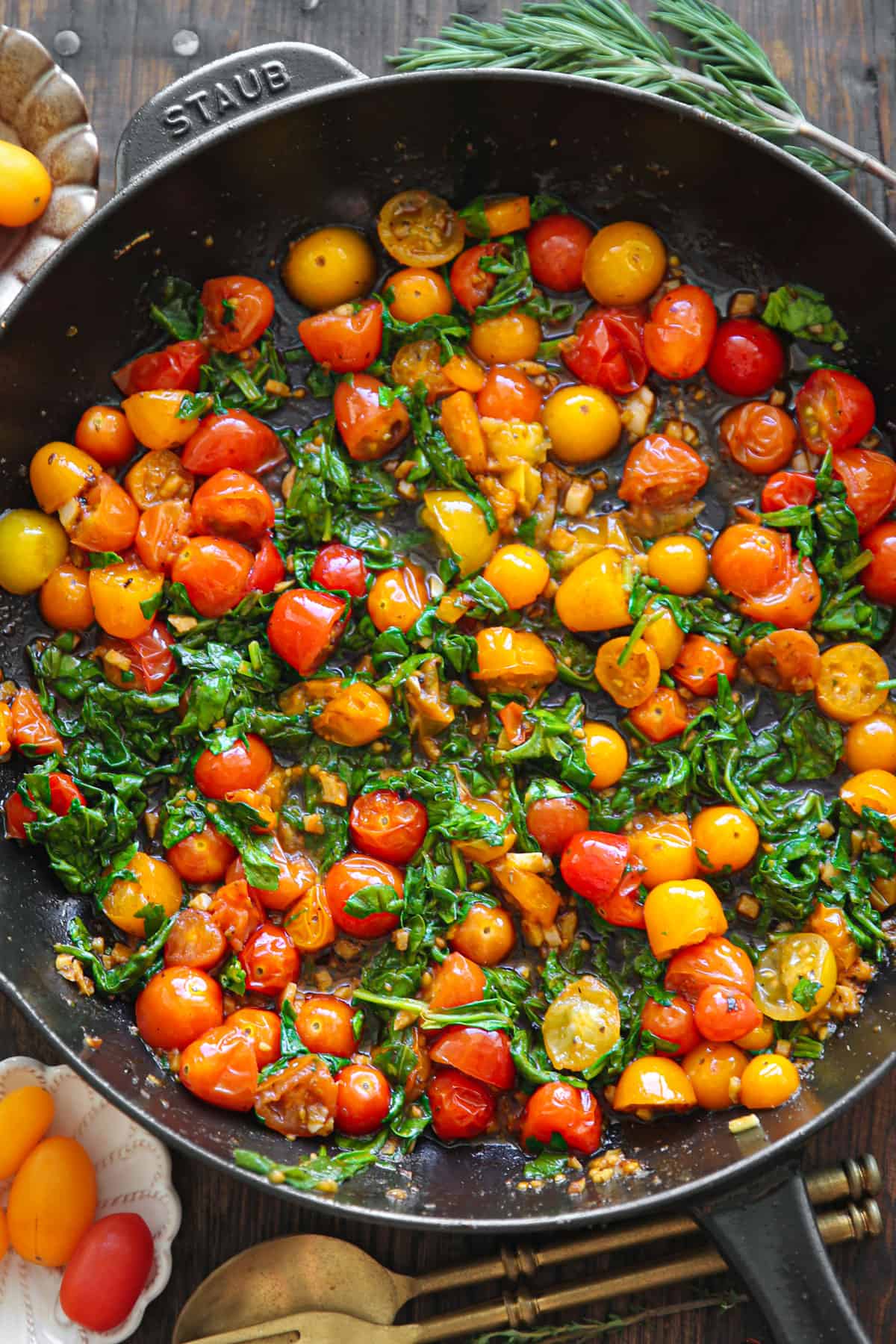 cooked cherry tomatoes and spinach - in a cast iron skillet.