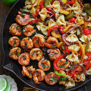 Shrimp Pasta with Bell Peppers and Red Onions (fajita-style) - in a cast iron skillet.