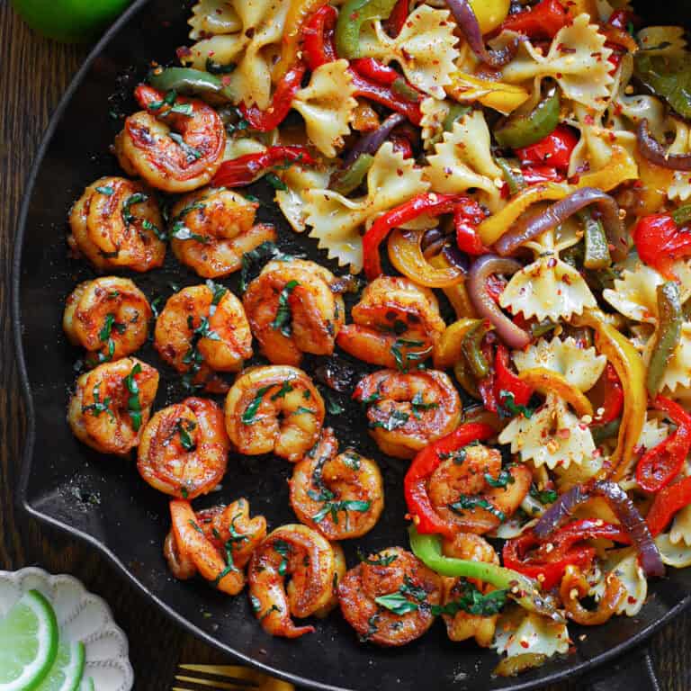Shrimp Pasta with Bell Peppers and Red Onions (fajita-style) - in a cast iron skillet.