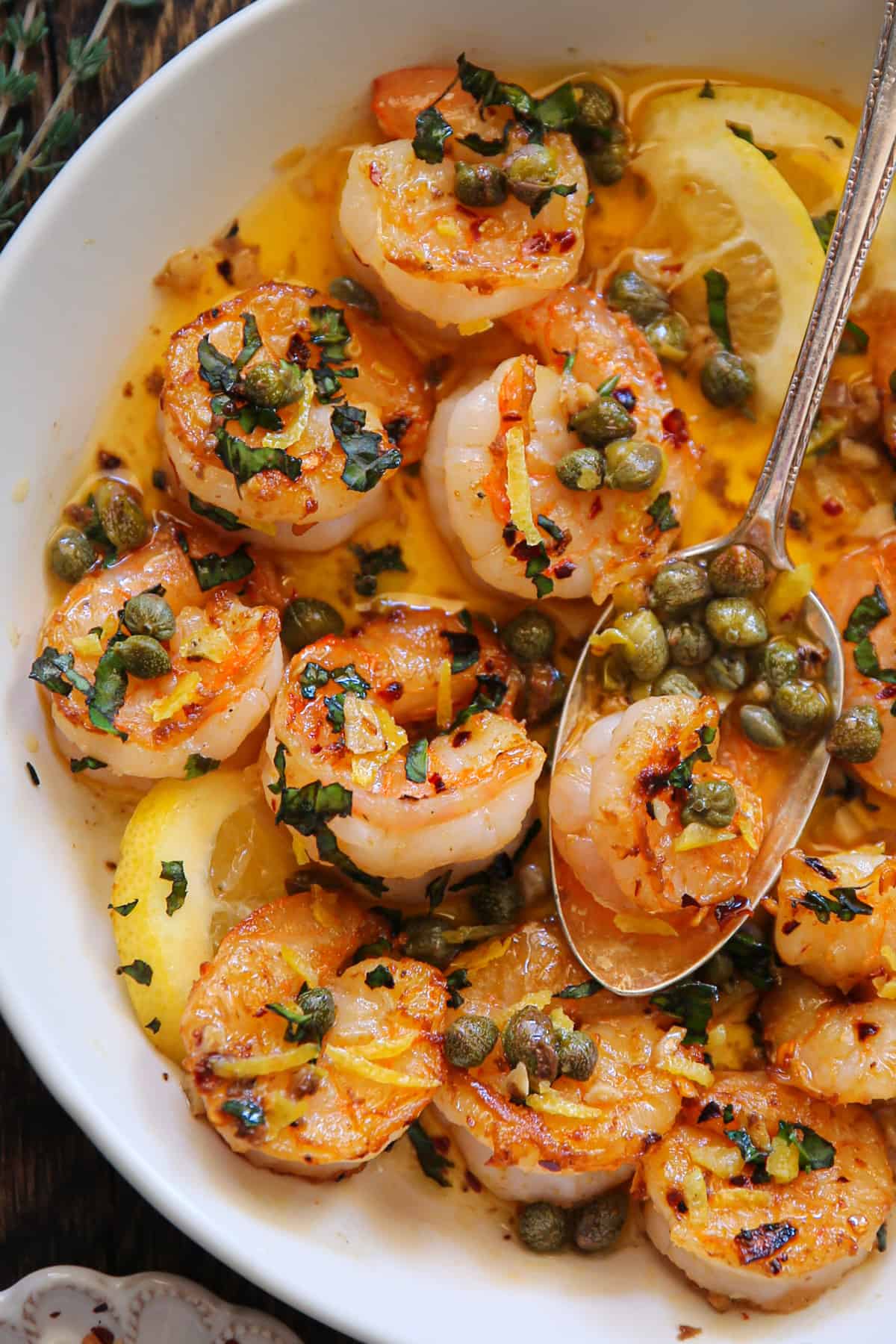 Shrimp Scampi with Lemon Garlic Butter Sauce and Capers - in a white bowl.