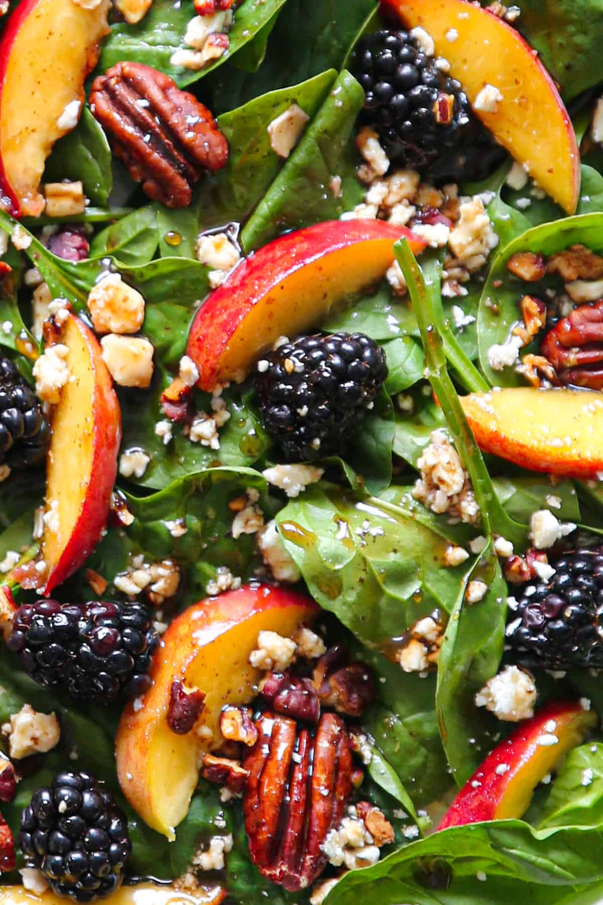 Summer Peach Spinach Salad with Blackberries, Pecans, Feta, and Balsamic Glaze (close-up photo).