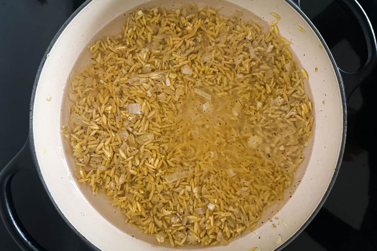 orzo with water in a pan.