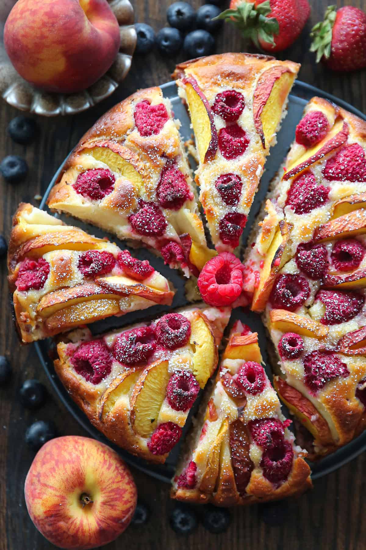 raspberry peach cake (sliced and topped with a small amount of powdered sugar).