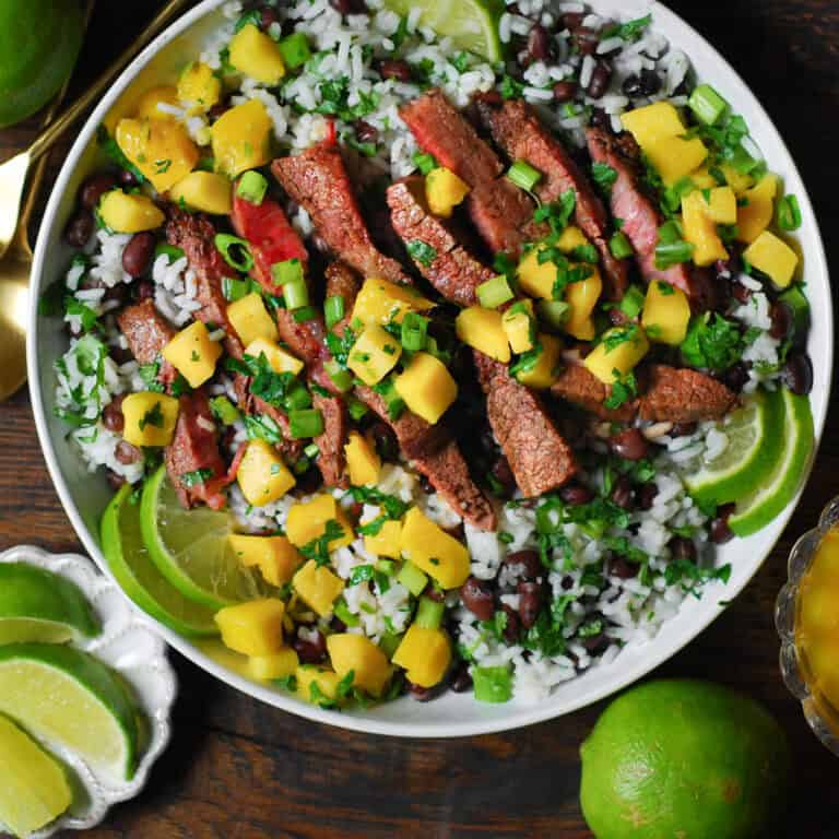 Flank Steak with Mango Salsa and Cilantro-Lime Black Bean Rice - in a white bowl.