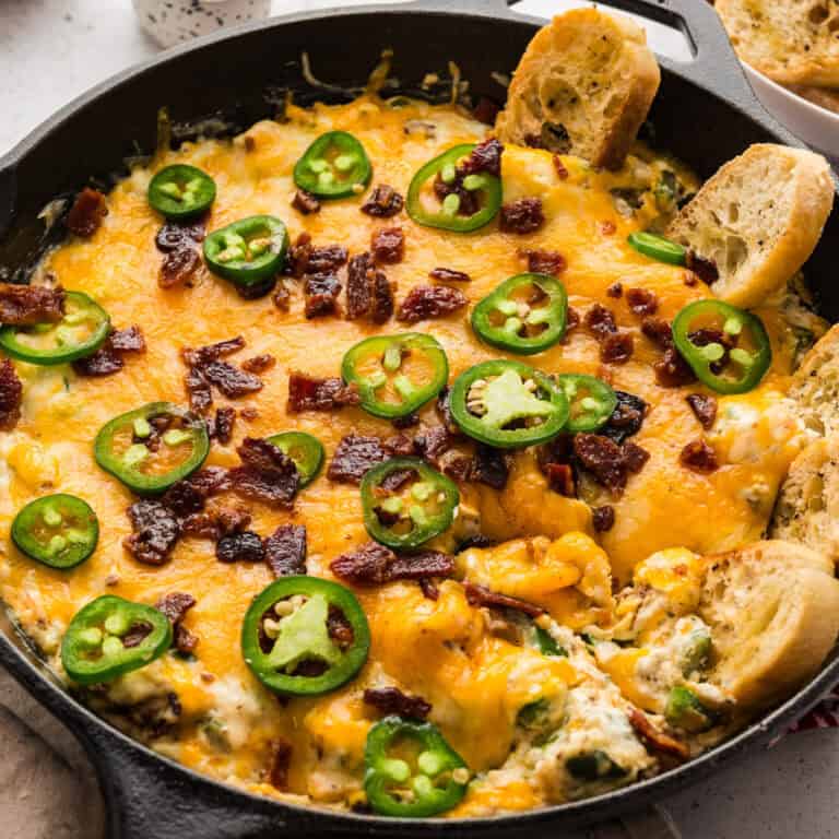 Jalapeno popper dip in a cast iron skillet.