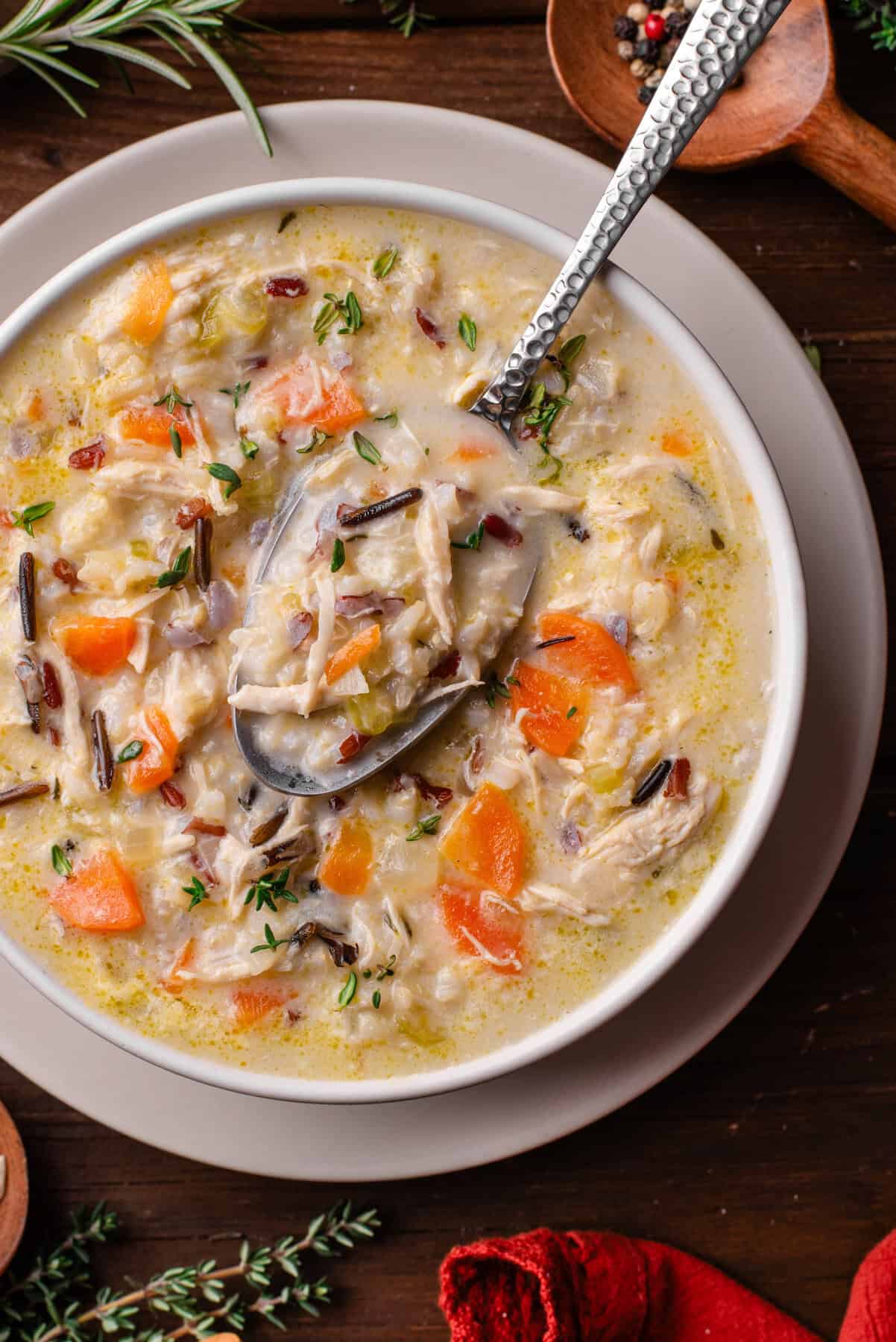 Creamy Chicken & Wild Rice Soup with Carrots in a bowl.