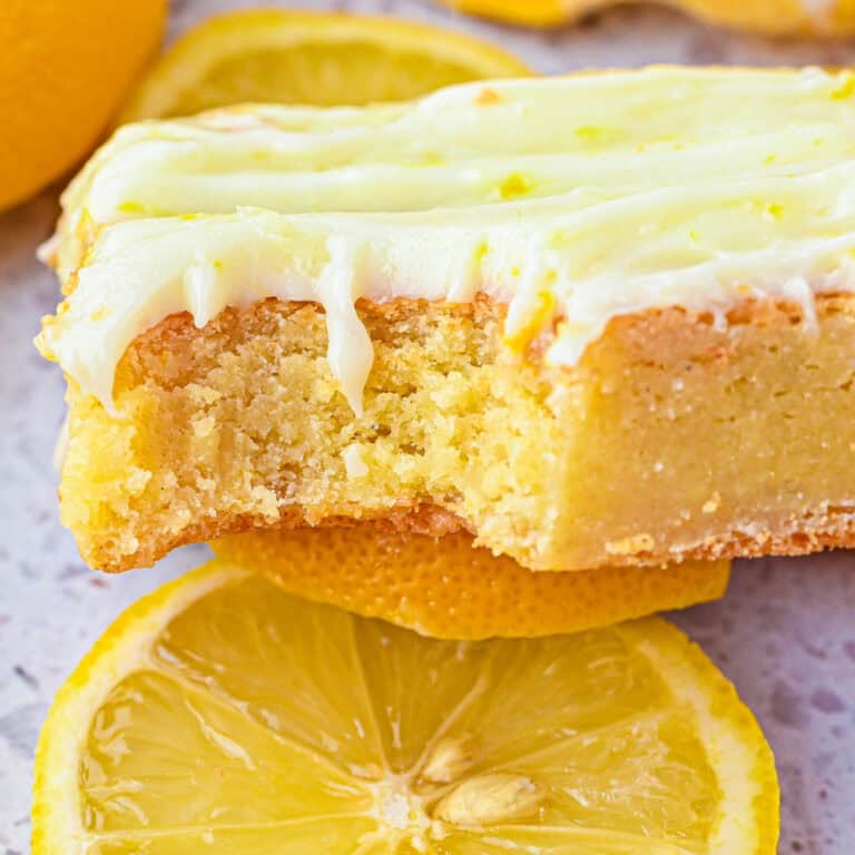 Lemon brownie topped with a light cream cheese frosting.