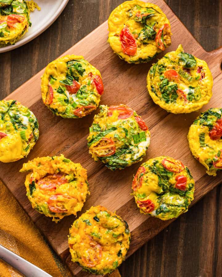 Breakfast Egg Muffins on a wooden cutting board.