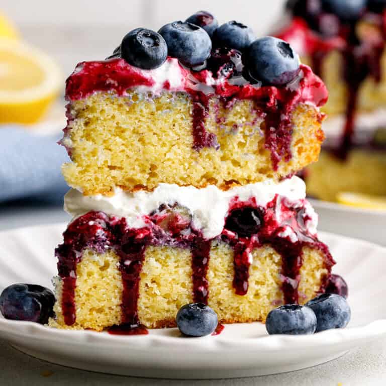 a slice of Blueberry Shortcake Cake on a plate.