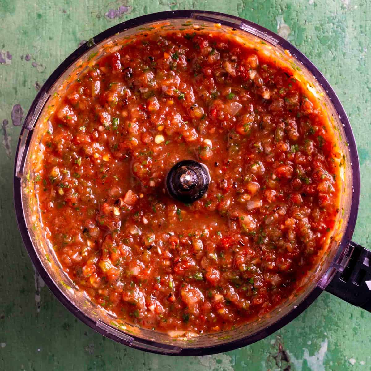 Roasted tomato salsa in a food processor.