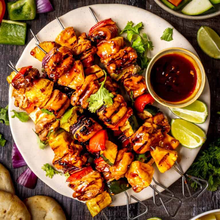 Hawaiian Grilled Teriyaki Chicken Pineapple Skewers - on a white plate.