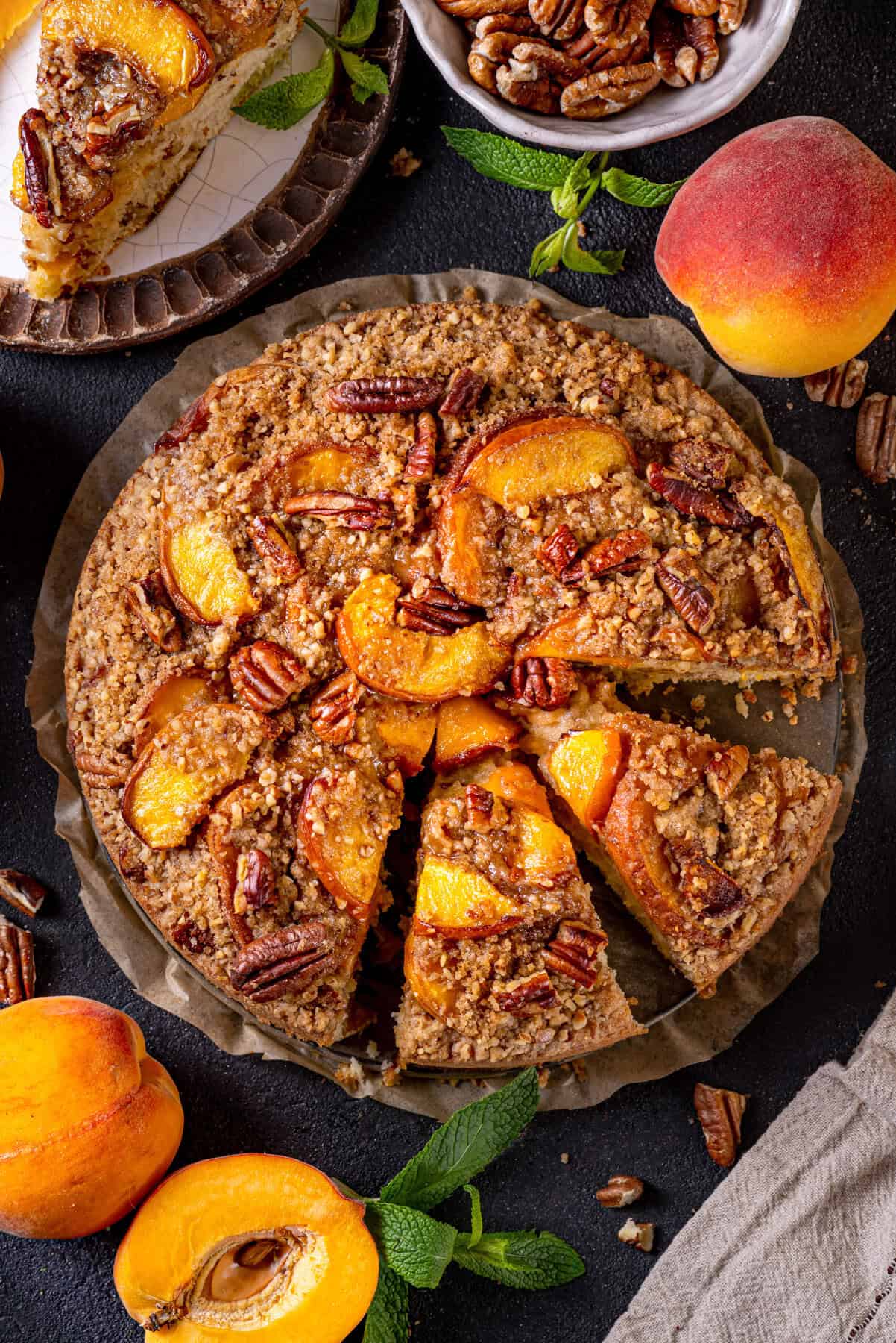 Peach Coffee Cake with Pecan Streusel Peach Coffee Cake topped with Pecan Streusel and Peach Slices.