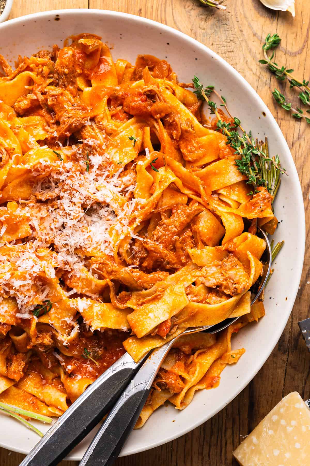 Braised Pork Ragu Pappardelle in a white bowl.