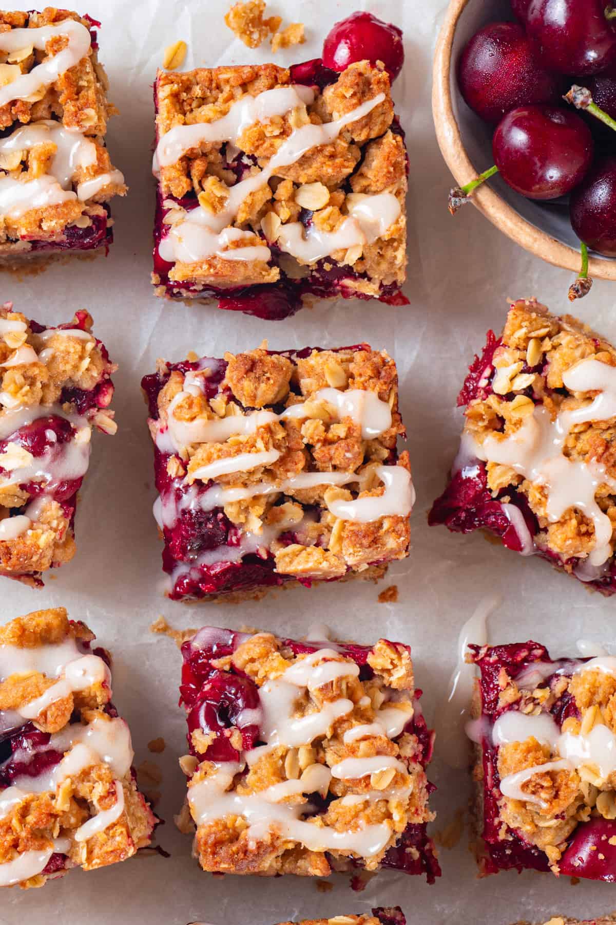 Cherry Pie Bars Cherry Pie Bars with Oat Crust drizzled with Lemon Glaze.