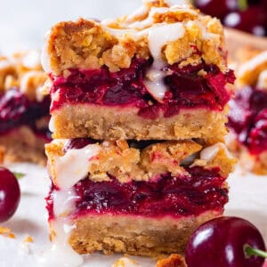 Cherry Pie Bars with Oat Crust and Lemon Glaze (2 bars stacked on each other).