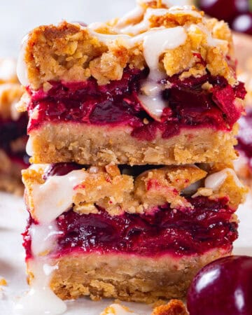 Cherry Pie Bars with Oat Crust and Lemon Glaze (2 bars stacked on each other).