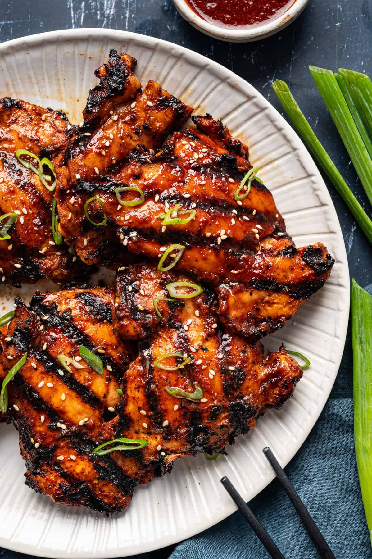 Korean BBQ Chicken Thighs on a white plate.