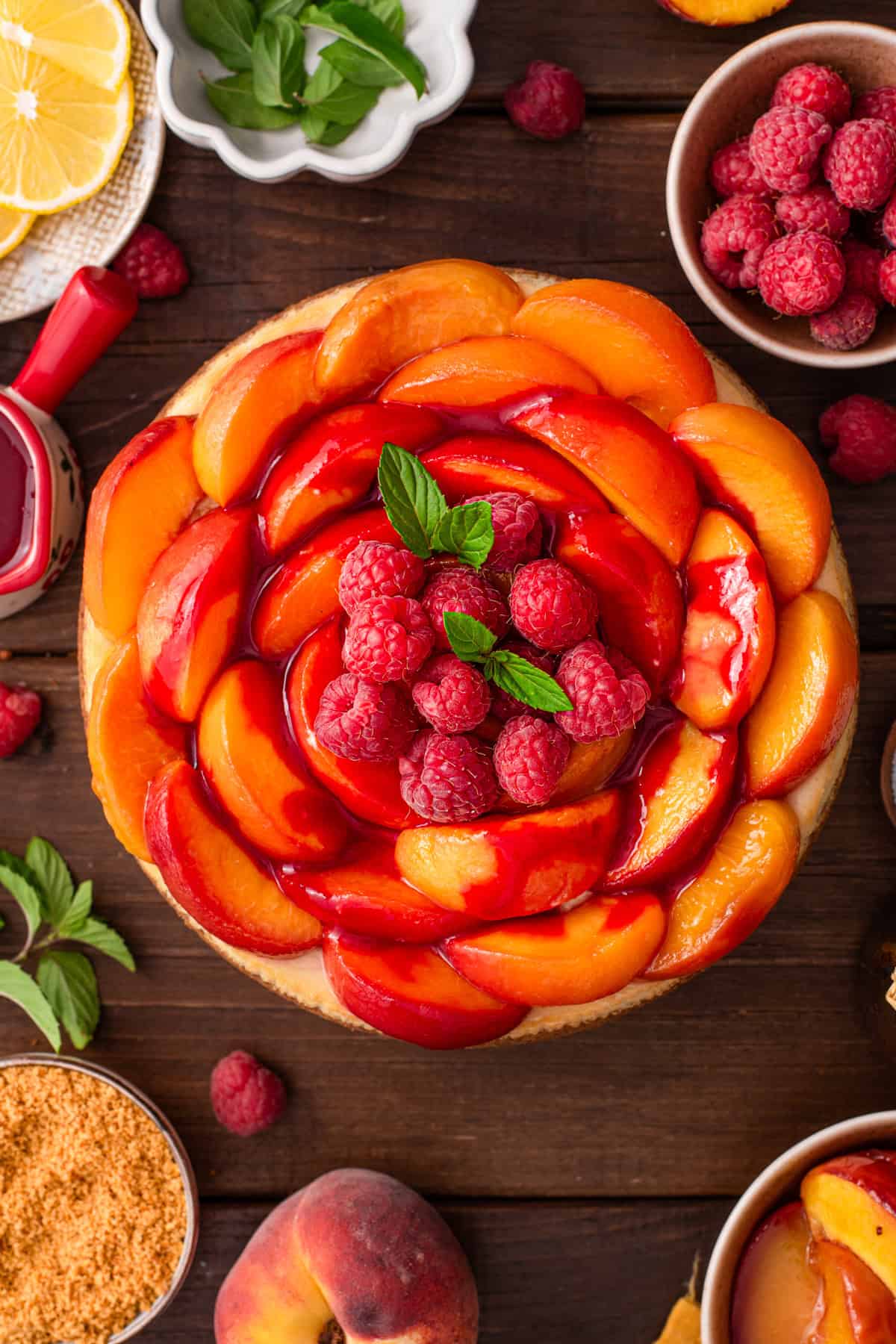 Peach Raspberry Cheesecake Peach Raspberry Cheesecake on a dark background (overhead view).