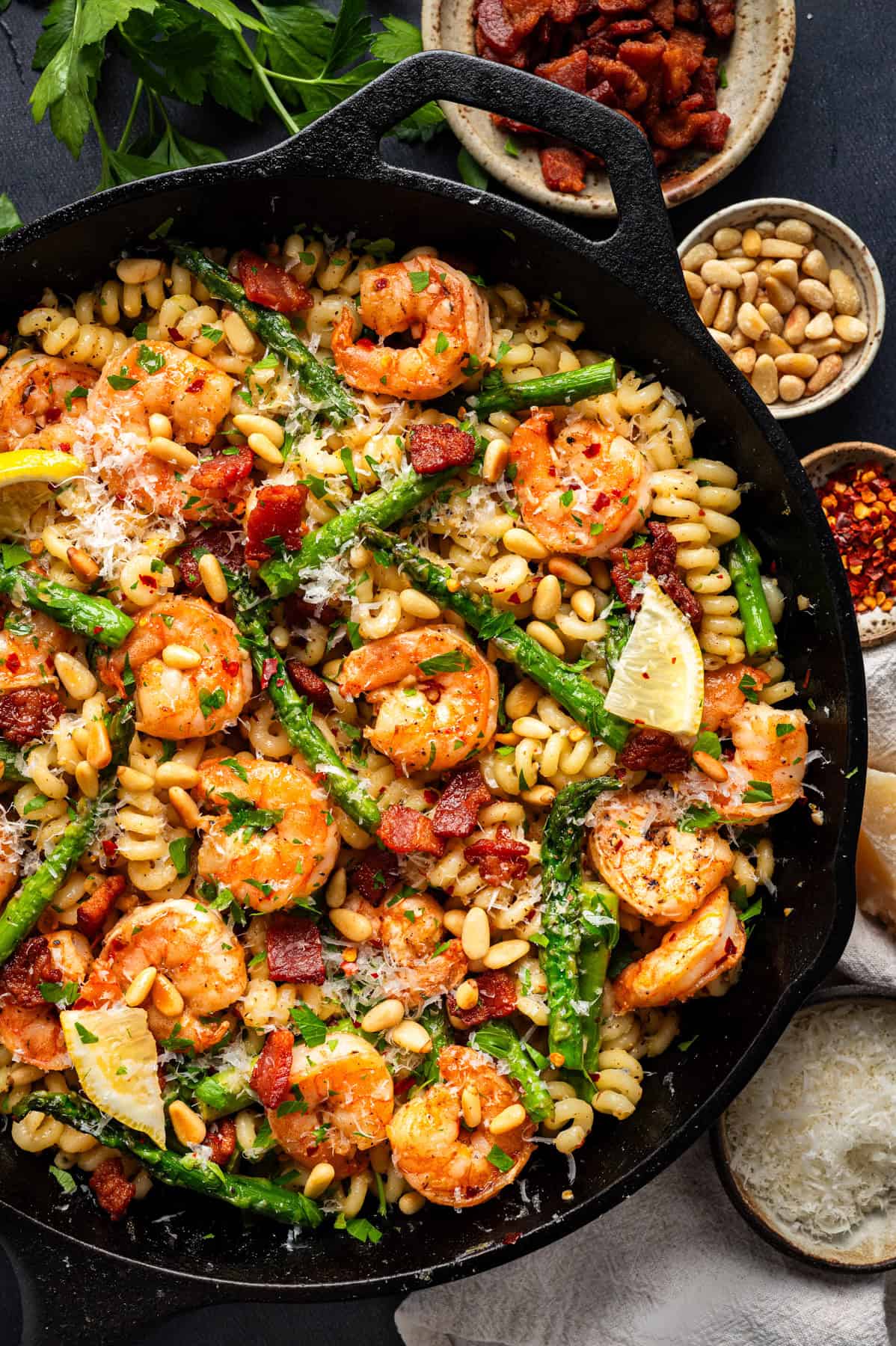 Shrimp Asparagus Pasta with Bacon, Parmesan, and Pine Nuts Shrimp Asparagus Pasta with Bacon, Parmesan, and Pine Nuts - in a cast iron skillet.