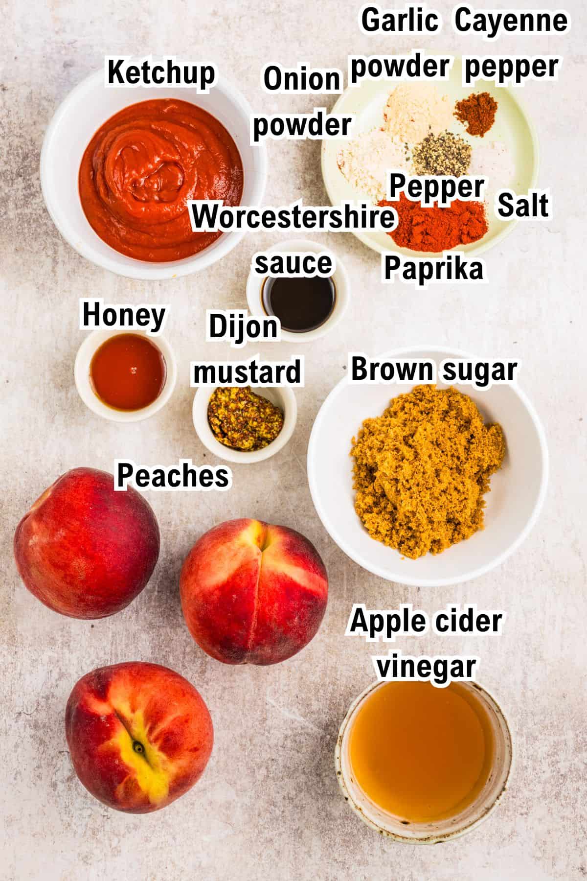 This photo shows the ingredients for a peach sauce recipe:  including ketchup, onion and garlic powder, cayenne, pepper, salt, paprika, Worcestershire sauce, honey, Dijon mustard, brown sugar, peaches, and apple cider vinegar.