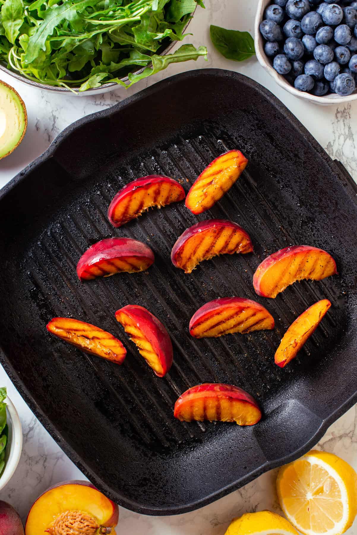 Grilled Peaches Grilled peaches in a black cast iron grill pan.