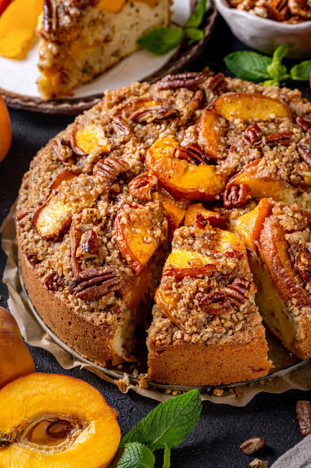 Peach Coffee Cake with Pecan Streusel Peach Coffee Cake topped with Pecan Streusel and Peach Slices.
