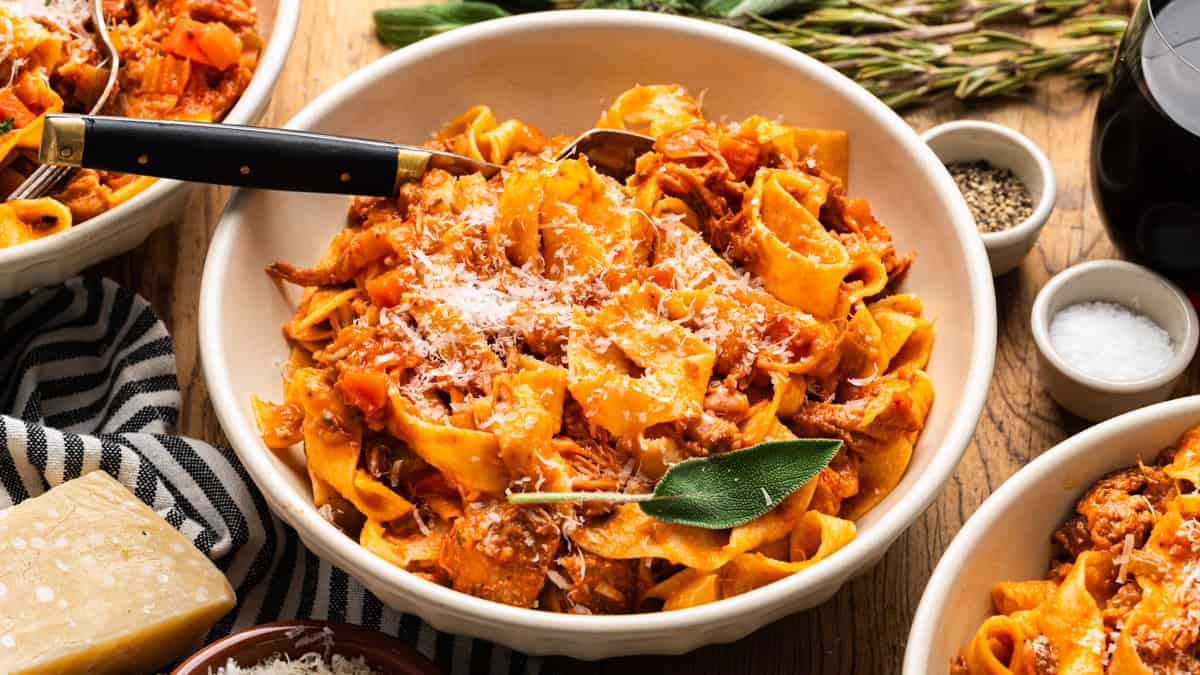 Braised Pork Ragu Pappardelle in a white bowl.