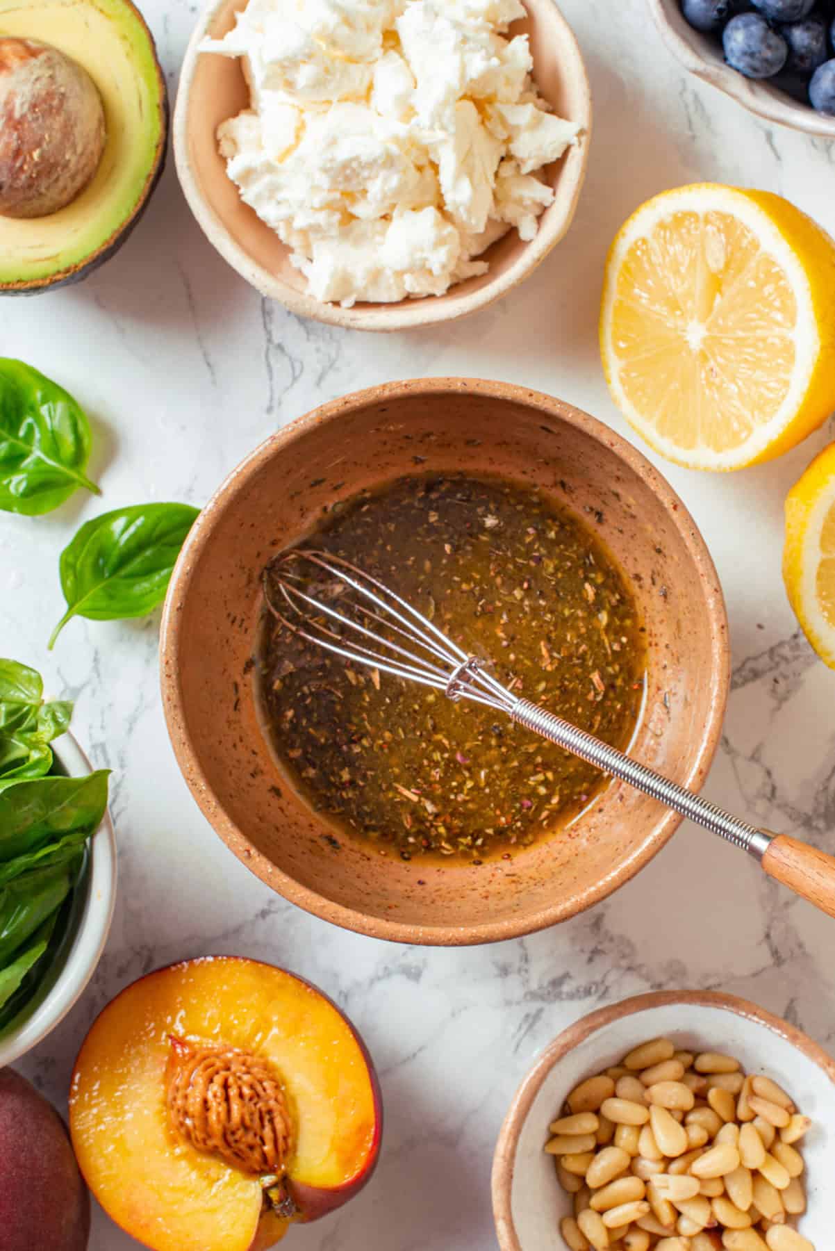 Honey-mustard lemon dressing for grilled peach salad. Honey-mustard lemon dressing in a bowl.