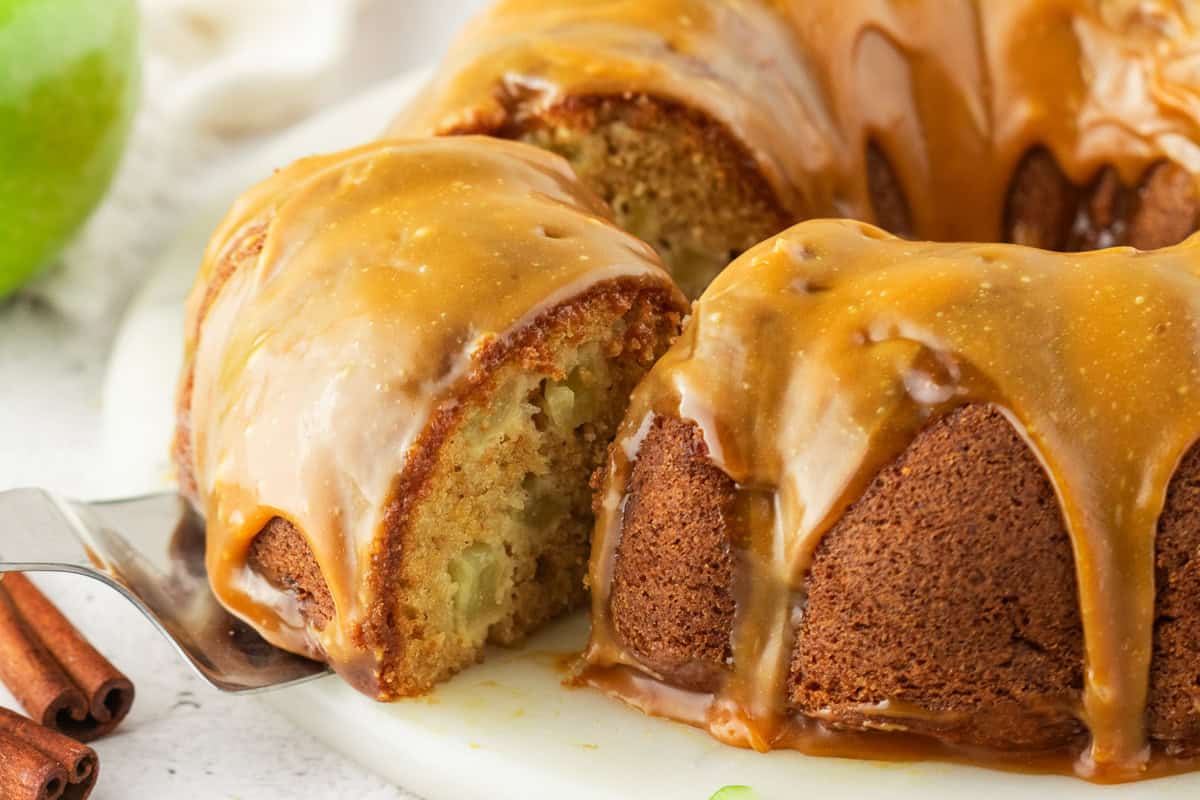 Apple Bundt Cake with Caramel Sauce Apple Bundt Cake with Caramel Sauce - on a cake stand.